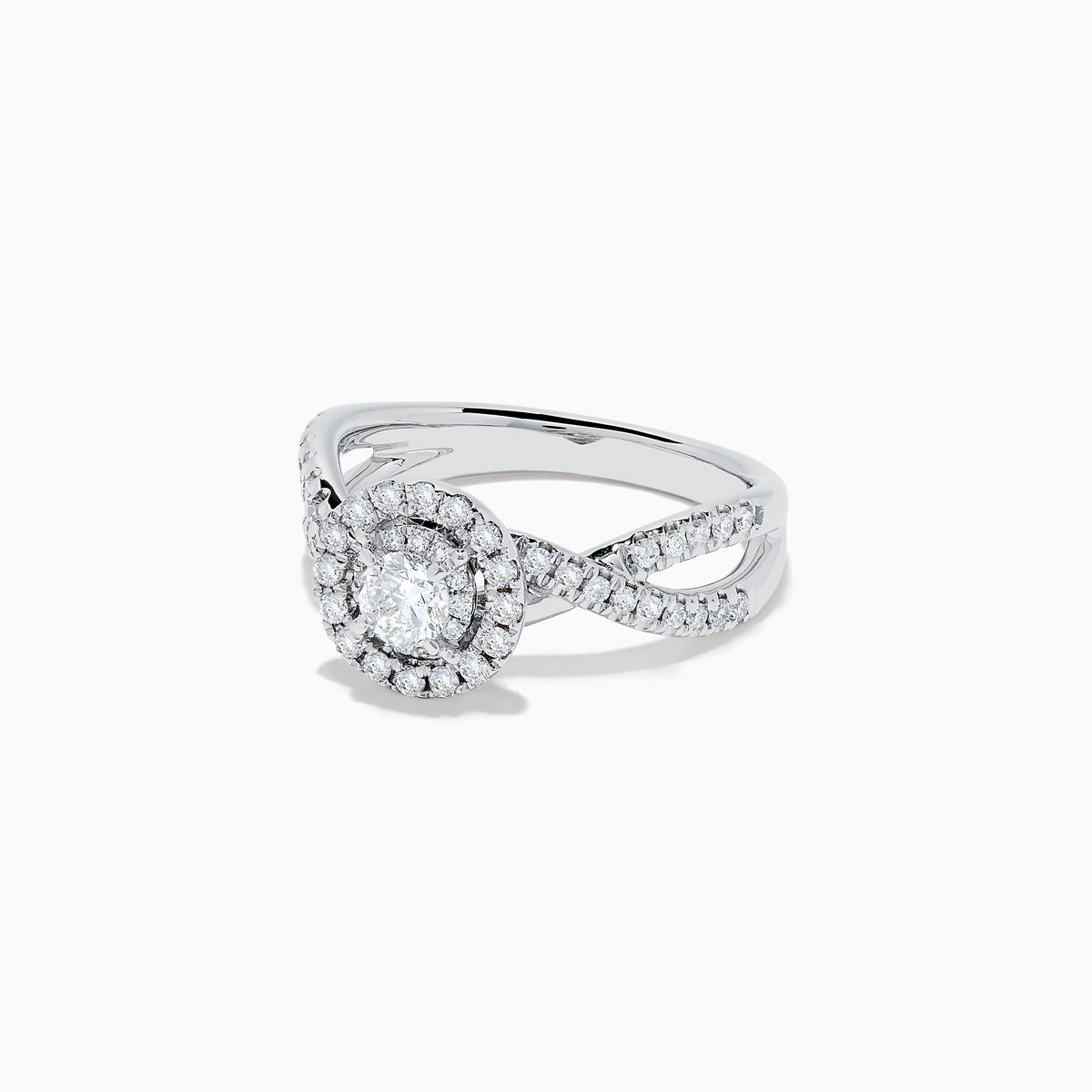 The Pave Classica 14K White Gold Diamond Ring features a round center diamond, double halo of smaller diamonds, and a split shank band with sparkling stones, beautifully displayed on a white background.
