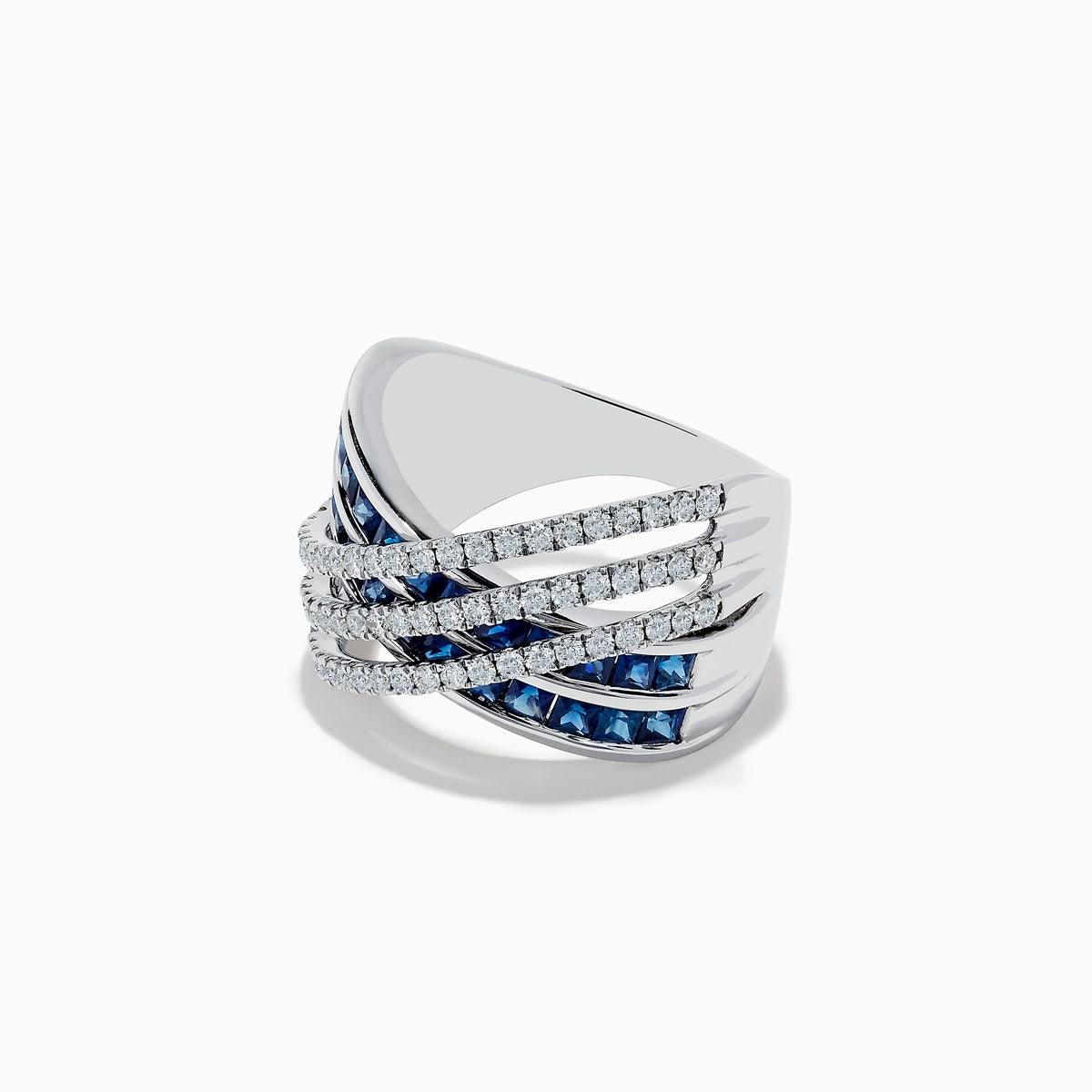 The 14K White Gold Blue Sapphire and Diamond Criss Cross Ring features an intricate, layered design with shimmering blue sapphires and rows of sparkling white diamonds.