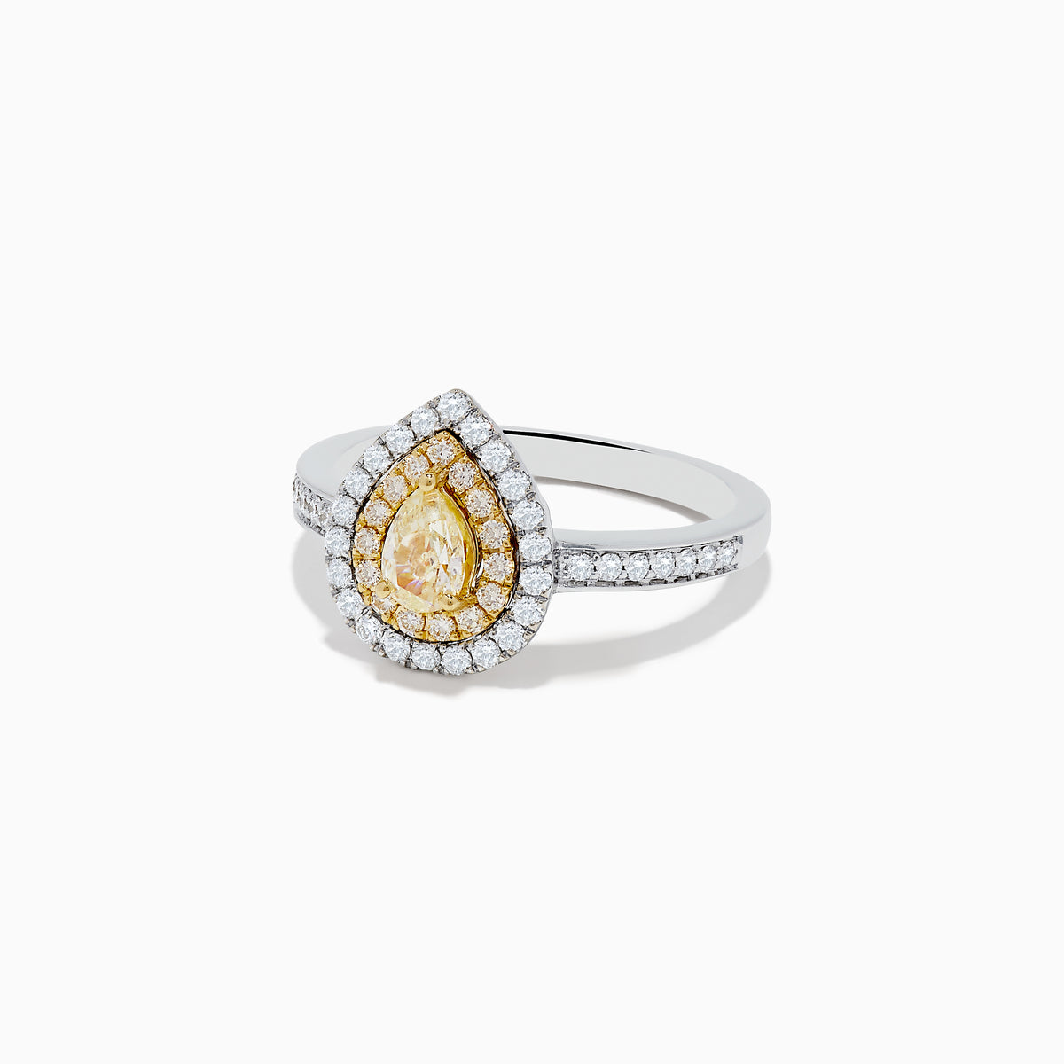The Canare 14K Two Tone Gold Yellow and White Diamond Ring features a pear-shaped yellow diamond with a double halo of white and yellow diamonds, set on a two tone gold band adorned with small round diamonds.