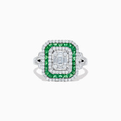 The Brasilica 14K White Gold Emerald and Diamond Ring showcases an emerald-cut diamond center, double square halos of diamonds and green emeralds, with additional diamonds on the split shank band, all set against a white background.