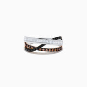 The 14K Three-Tone Gold Brown, Black and White Diamond Crossover Ring (0.63 TCW) features rows of baguette white, round black, and round brown diamonds elegantly crisscrossing on a lustrous gold band.