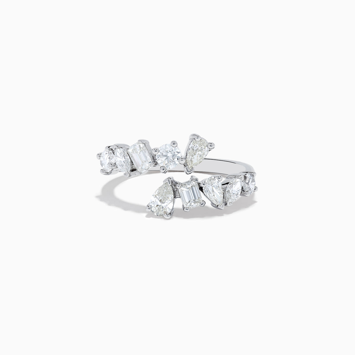 The Classique 14K White Gold Diamond Bypass Ring 1.36 TCW features multiple clear diamonds in teardrop, round, and rectangular cuts set asymmetrically on a sleek open band, styled against a plain white background.