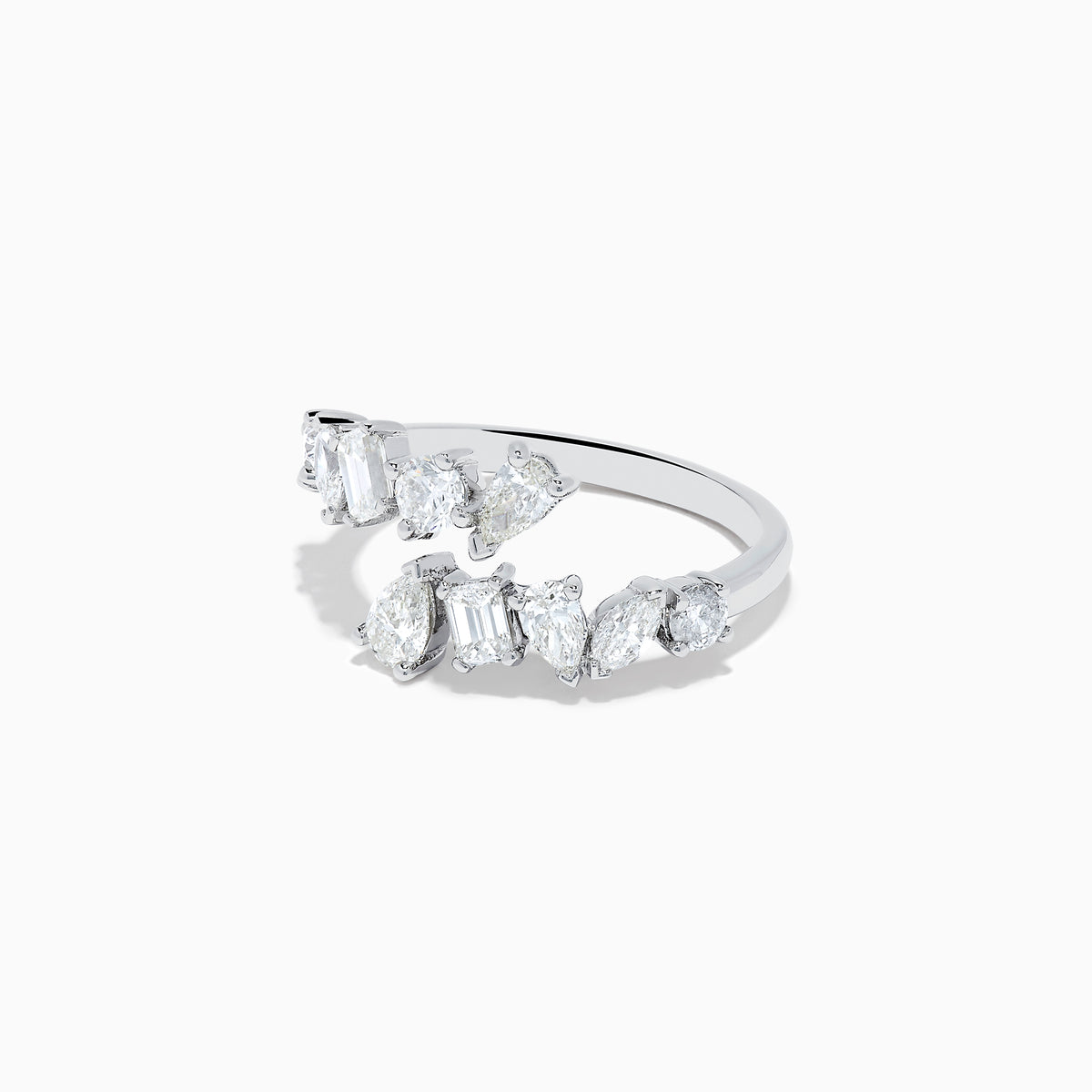 The Classique 14K White Gold Diamond Bypass Ring 1.36 TCW features multiple clear diamonds in teardrop, round, and rectangular cuts set asymmetrically on a sleek open band, styled against a plain white background.