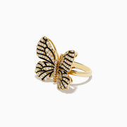 The Nature 14K Yellow Gold Black and White Diamond Butterfly Ring features sparkling diamonds and black details on its wings, echoing the elegance of black and white diamond jewelry, shown against a plain white background.