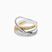 The 14K Two-Tone Gold Yellow and White Diamond Crossover Ring showcases intertwined bands of yellow and white diamonds in gold and silver for a modern, elegant look.
