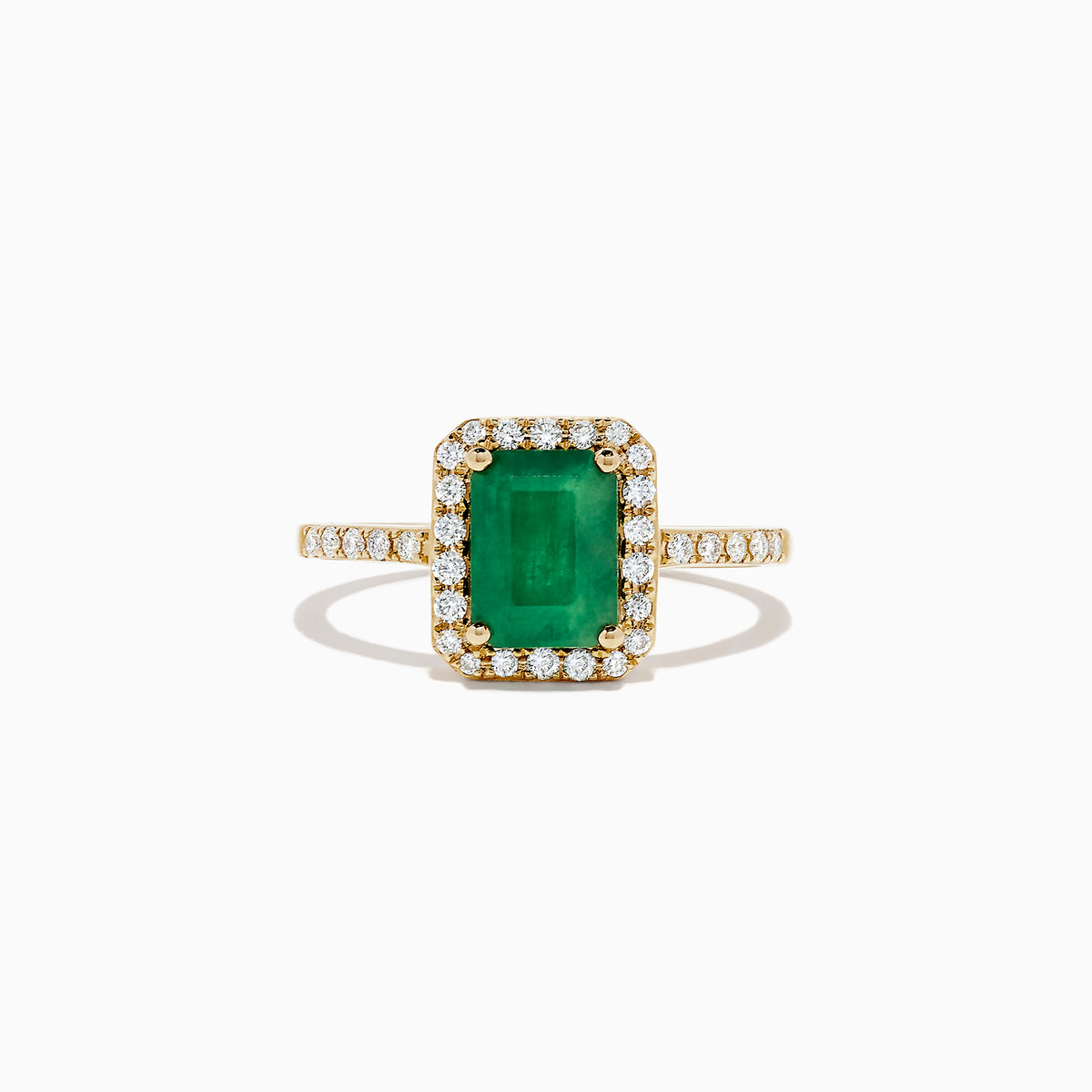 The Brasilica 14K Yellow Gold Emerald and Diamond Ring, 1.69 TCW, showcases a rectangular green emerald center surrounded by a halo of round diamonds with additional diamonds set along the band.