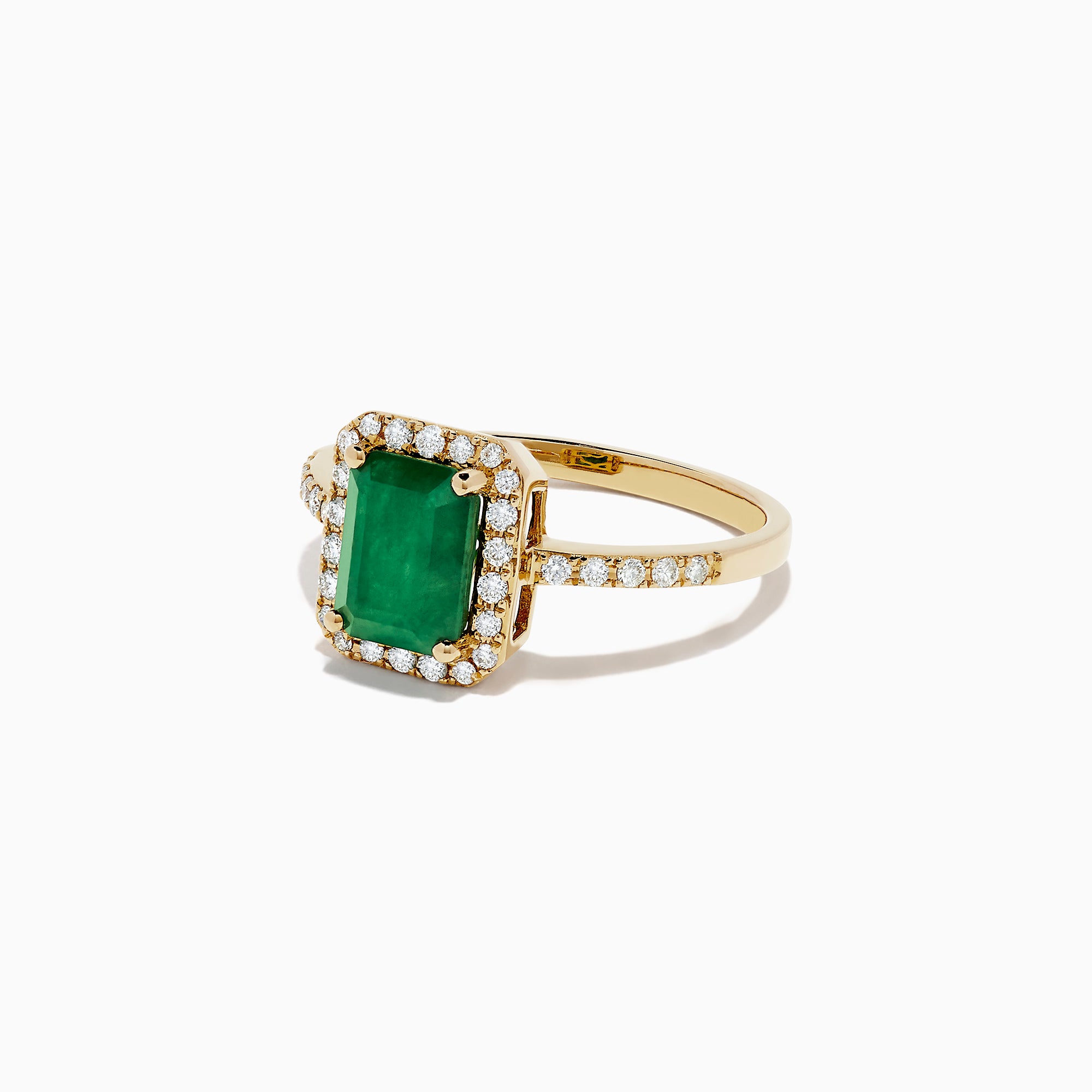 The Brasilica 14K Yellow Gold Emerald and Diamond Ring, 1.69 TCW, showcases a rectangular green emerald center surrounded by a halo of round diamonds with additional diamonds set along the band.