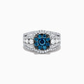 The Bella Bleu 14K White Gold Blue and White Diamond Ring, 2.16 TCW, features a striking cluster of round blue gemstones at the center with sparkling diamonds along its split shank band, shown on a white background.