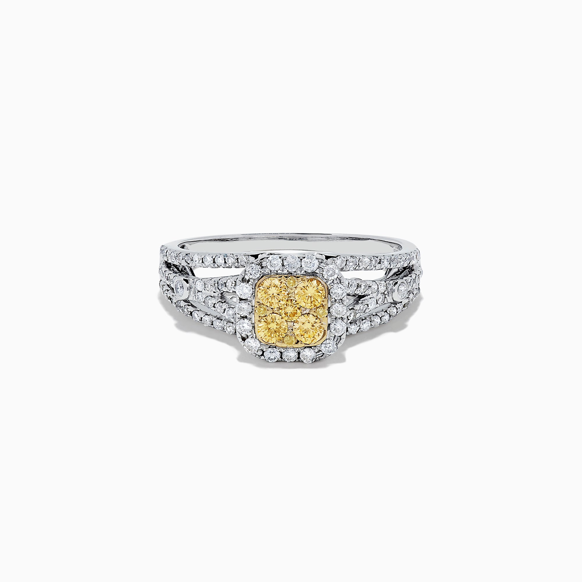 The Canare 14K Two Tone Gold Cushion Shaped Cluster Yellow Diamond Ring, 0.72 TCW, features a cushion-cut yellow stone surrounded by clear diamonds and additional diamonds set along the split band.