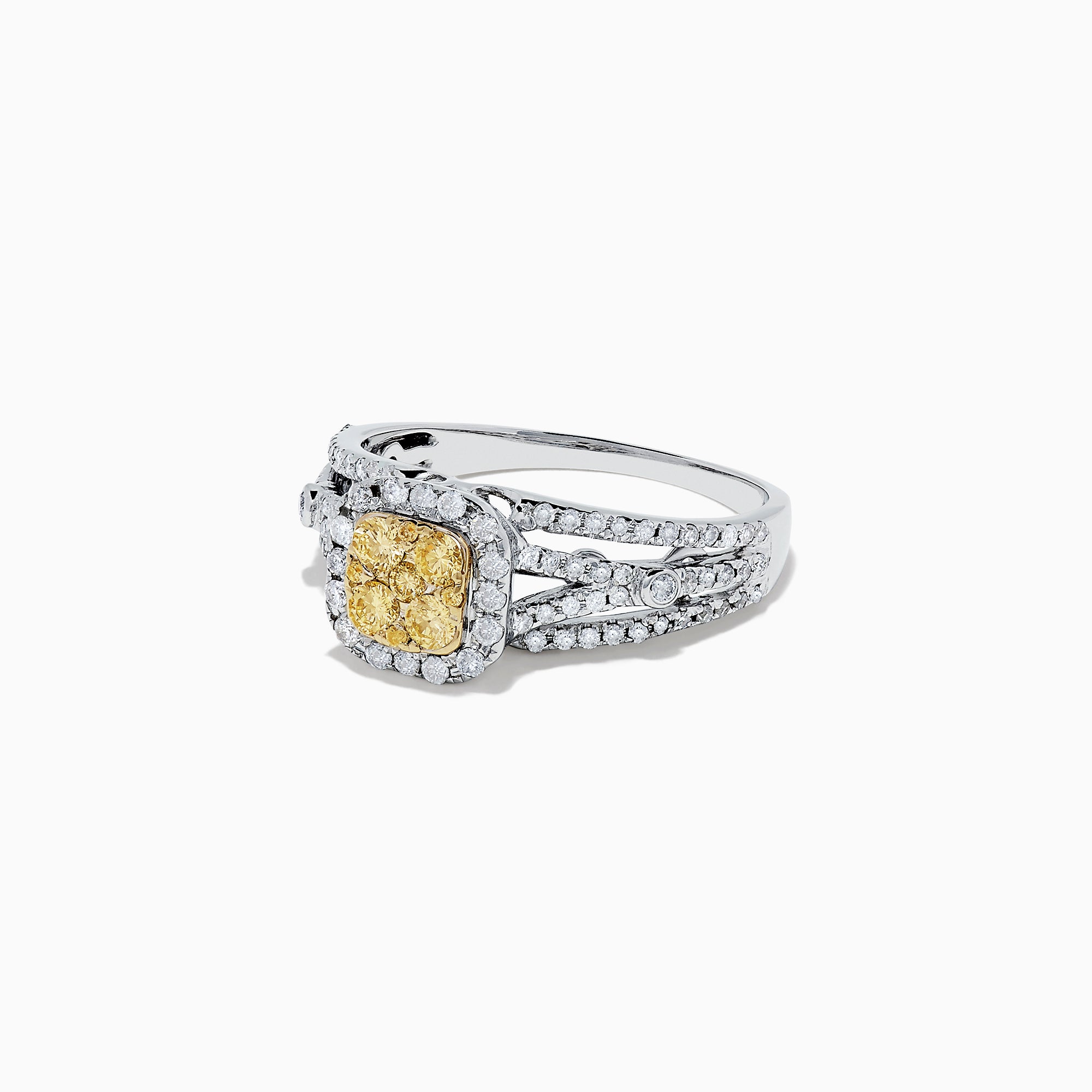 The Canare 14K Two Tone Gold Cushion Shaped Cluster Yellow Diamond Ring, 0.72 TCW, features a cushion-cut yellow stone surrounded by clear diamonds and additional diamonds set along the split band.