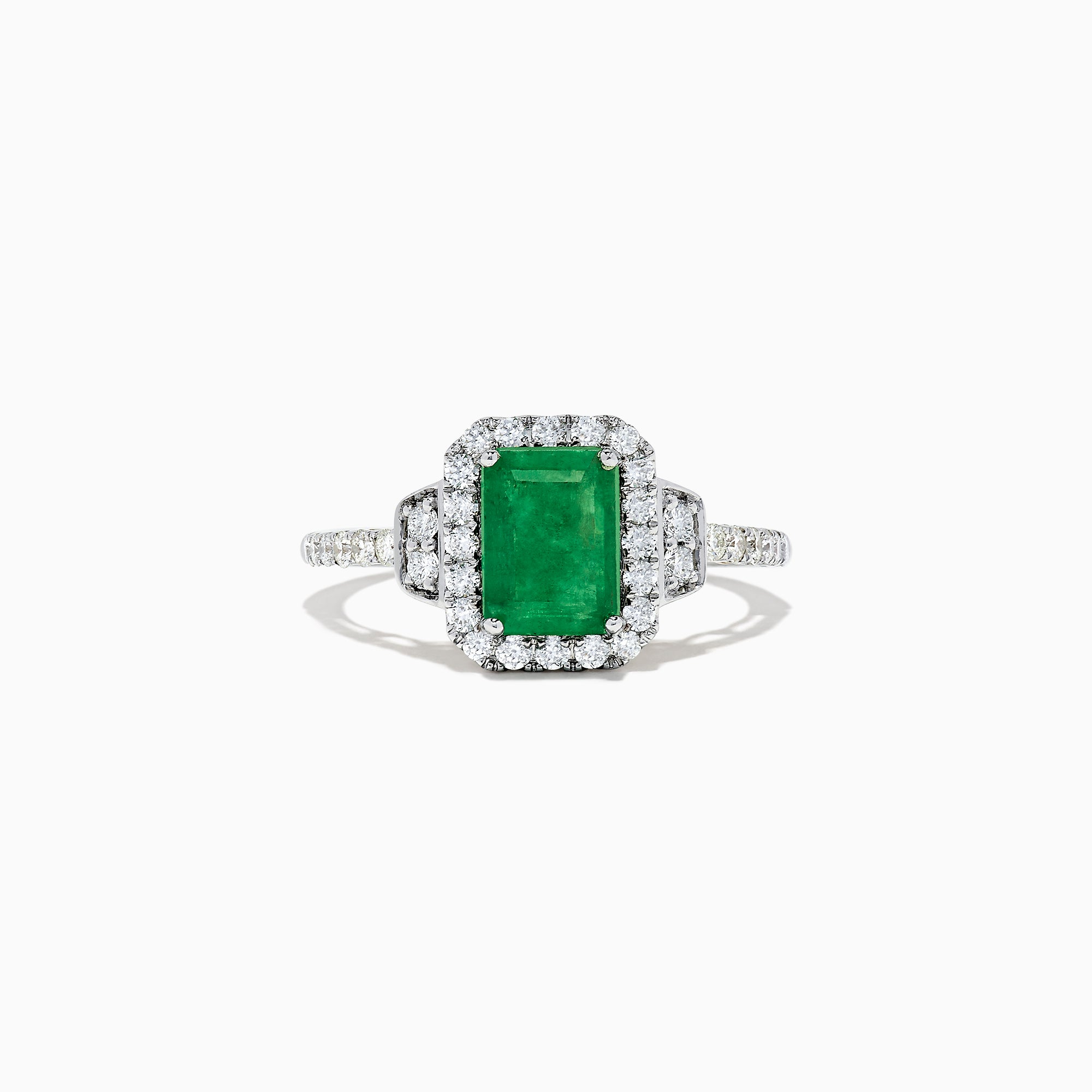 The Brasilica 14K Two Tone Gold Emerald and Diamond Ring, 1.90 TCW, features a striking rectangular emerald center, encircled by round diamonds and further accented with diamonds along the gold band.