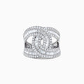 A 14K white gold diamond ring, 1.42 TCW, featuring baguette and round-cut diamonds with an interlocking geometric center design.