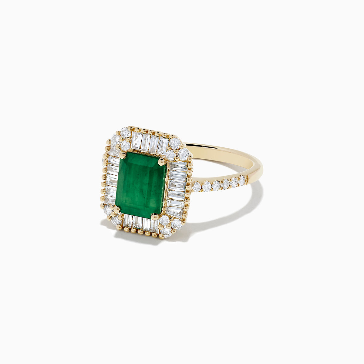 The Brasilica 14K Yellow Gold Emerald and Diamond Ring, 2.00 TCW, showcases a vivid rectangular emerald accented by baguette and round-cut diamonds, plus additional diamonds along the band for extra sparkle.