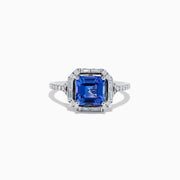 The Nahla Siri 14K White Gold Tanzanite and Diamond Ring showcases a large, square-cut blue tanzanite center with round and baguette-cut diamonds, displayed on a white background.