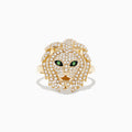 The Safari 14K Yellow Gold Diamond and Tsavorite Lion Head Ring (0.69 TCW) features a bold lion head adorned with sparkling diamonds and vivid green tsavorite eyes, shown against a plain white background.