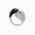 The Signature 14K Gold Black & White Diamond Double Panther Ring, 1.49 TCW, features two panther heads—one with black stones, the other with white—each set with vivid green gemstone eyes.