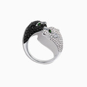 The Signature 14K Gold Black & White Diamond Double Panther Ring, 1.49 TCW, features two panther heads—one with black stones, the other with white—each set with vivid green gemstone eyes.
