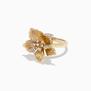 The Nature 14K Yellow Gold Diamond Flower Ring, 0.23 TCW, features detailed petals and sparkling diamond accents at the center and on one petal, displayed on a white background.