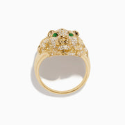 The Mens 14K Yellow Gold Emerald and Diamond Lion Ring features a lions head design with diamond accents and emerald eyes, showcased against a white background.