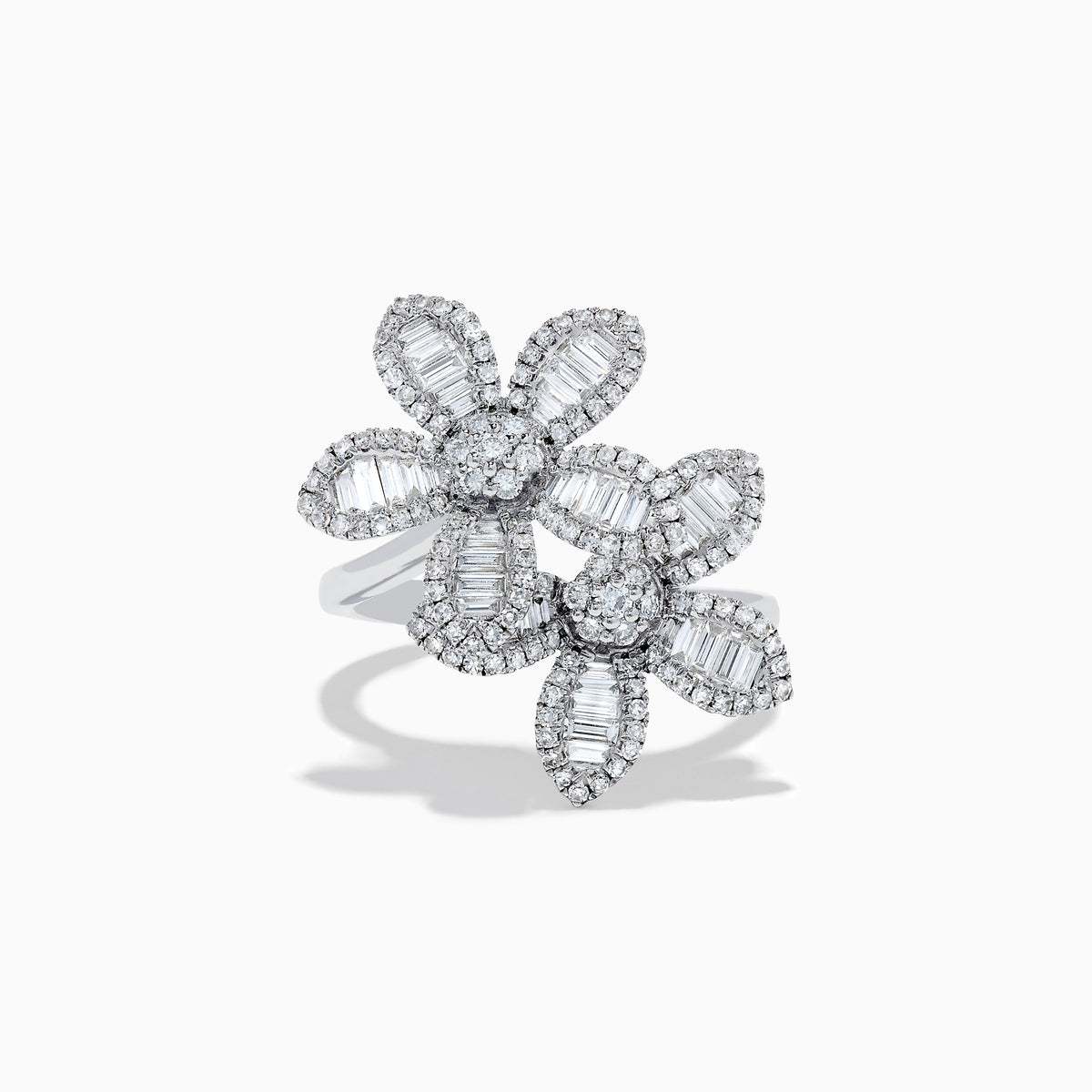 The 14K White Gold Diamond Multi Flower Ring features two overlapping flower designs with petals set with rectangular and round white diamonds, displayed against a plain white background.