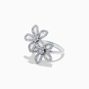 The 14K White Gold Diamond Multi Flower Ring features two overlapping flower designs with petals set with rectangular and round white diamonds, displayed against a plain white background.