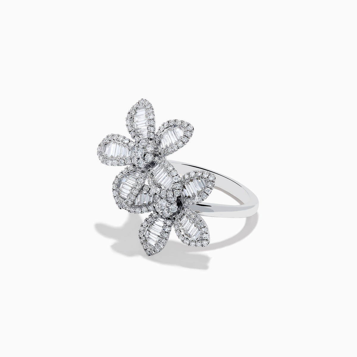 The 14K White Gold Diamond Multi Flower Ring features two overlapping flower designs with petals set with rectangular and round white diamonds, displayed against a plain white background.