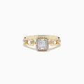 The Doro 14K Yellow Gold Diamond Ring showcases a rectangular baguette-cut center diamond, a halo of round diamonds, and extra small diamonds set along its split band.