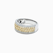 The Canare 14K Two Tone Gold Yellow and White Diamond Ring, 1.26 TCW, features three rows of round yellow diamonds bordered by two rows of white diamonds, all set in elegant two-tone gold and shown on a white background.