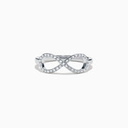 14K White Gold Diamond Infinity Pinky Ring, 0.13 TCW, features a diamond-studded infinity symbol design and is displayed on a white background.