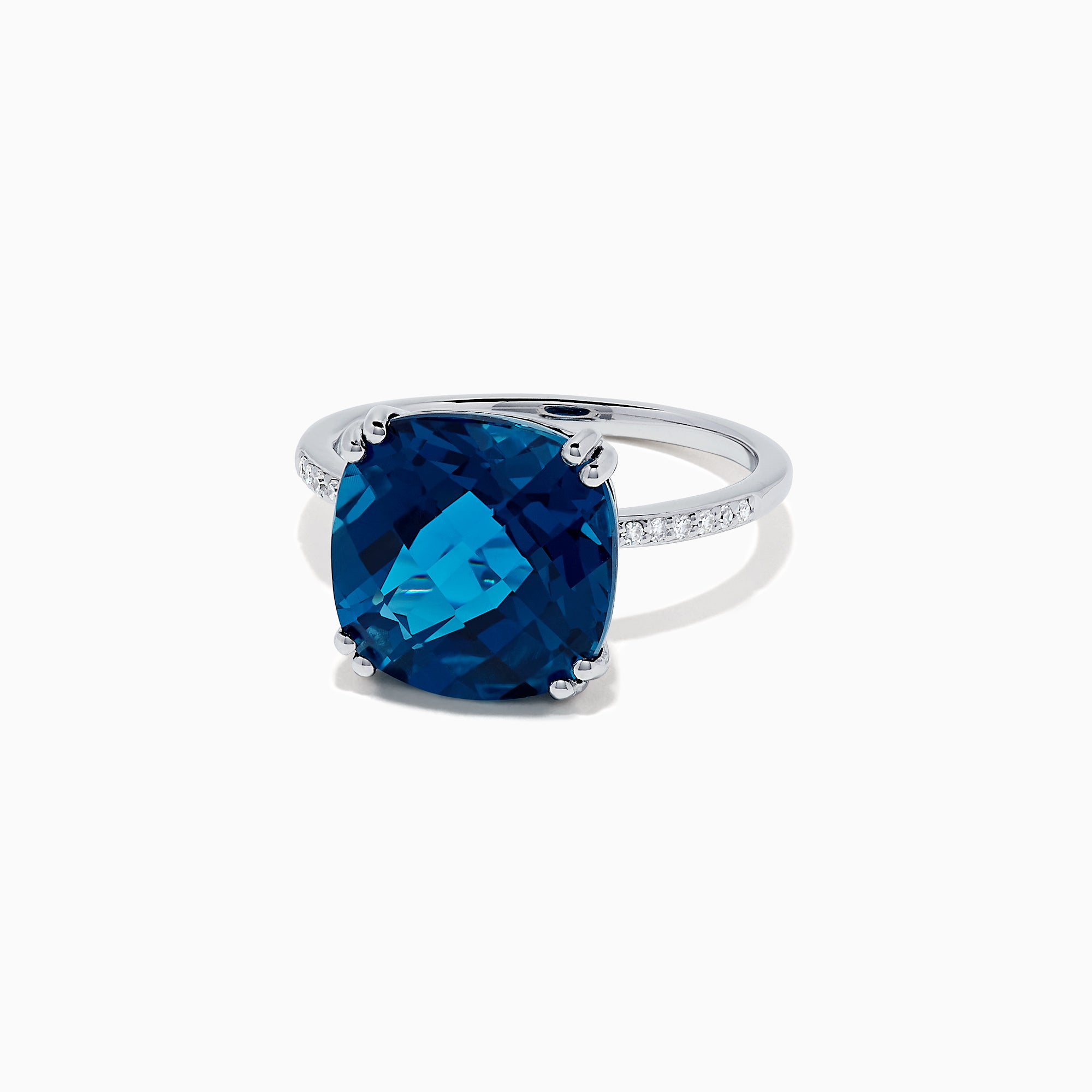 The Ocean Bleu 14K White Gold London Blue Topaz and Diamond Ring, 8.40 TCW, showcases a large cushion-cut London Blue Topaz center with four prongs and round diamonds set along the band.
