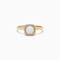 The Aurora 14K Yellow Gold Opal and Diamond Ring, 0.62 TCW, showcases an oval white opal center framed by a rectangular halo of sparkling diamonds, displayed on a plain white background.