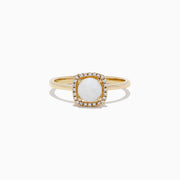 The Aurora 14K Yellow Gold Opal and Diamond Ring, 0.62 TCW, showcases an oval white opal center framed by a rectangular halo of sparkling diamonds, displayed on a plain white background.