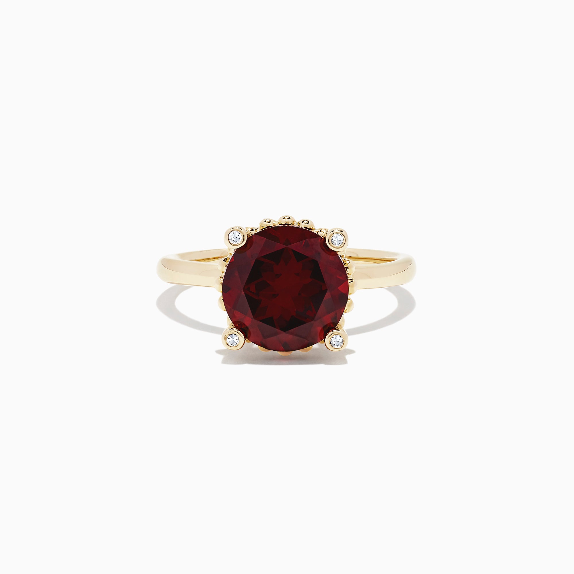 The Bordeaux 14K Yellow Gold Garnet and Diamond Ring, 5.67 TCW, features a large round deep-red garnet center with four small round white diamonds at the cardinal points, all set in elegant yellow gold.