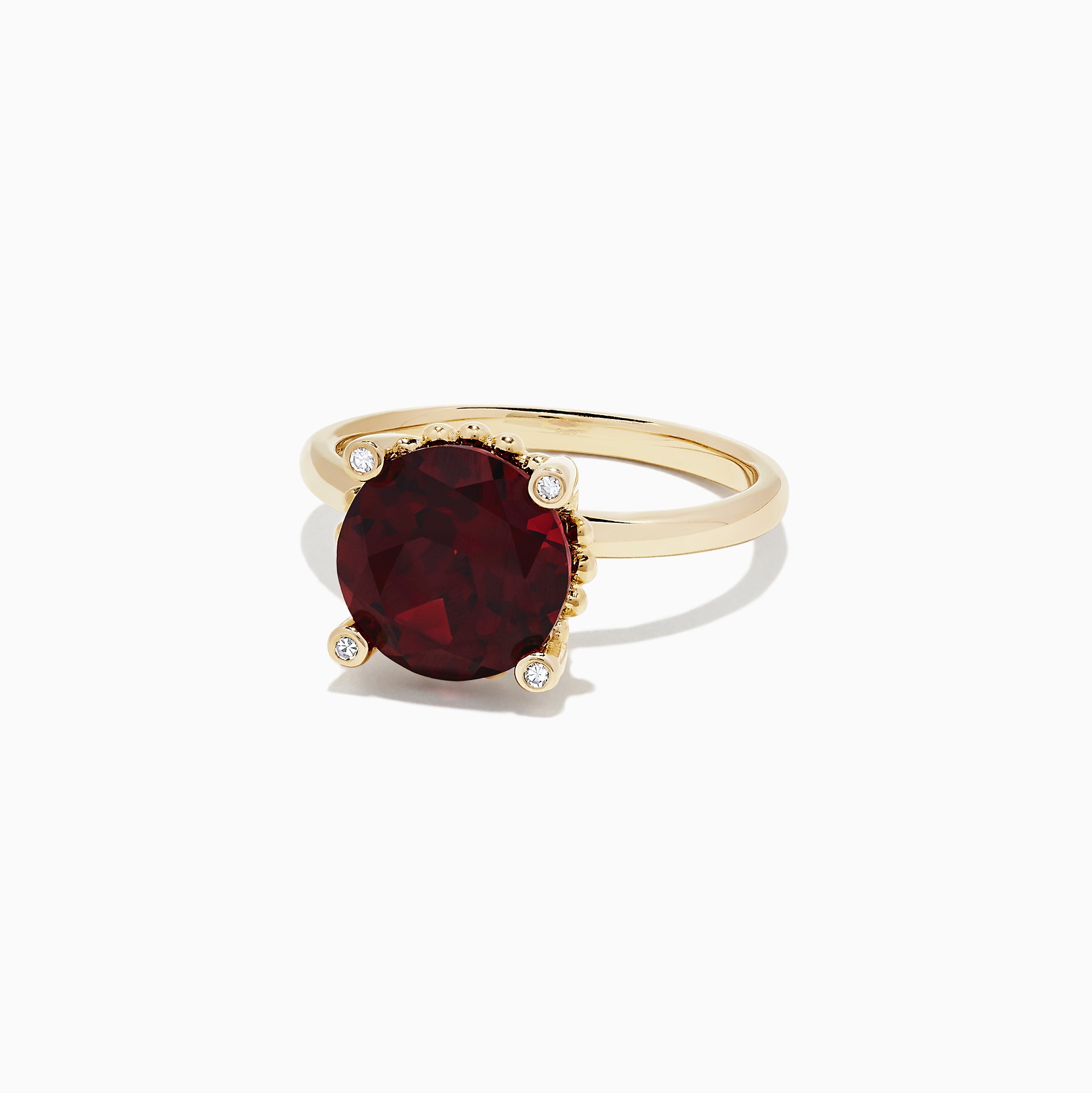 The Bordeaux 14K Yellow Gold Garnet and Diamond Ring, 5.67 TCW, features a large round deep-red garnet center with four small round white diamonds at the cardinal points, all set in elegant yellow gold.
