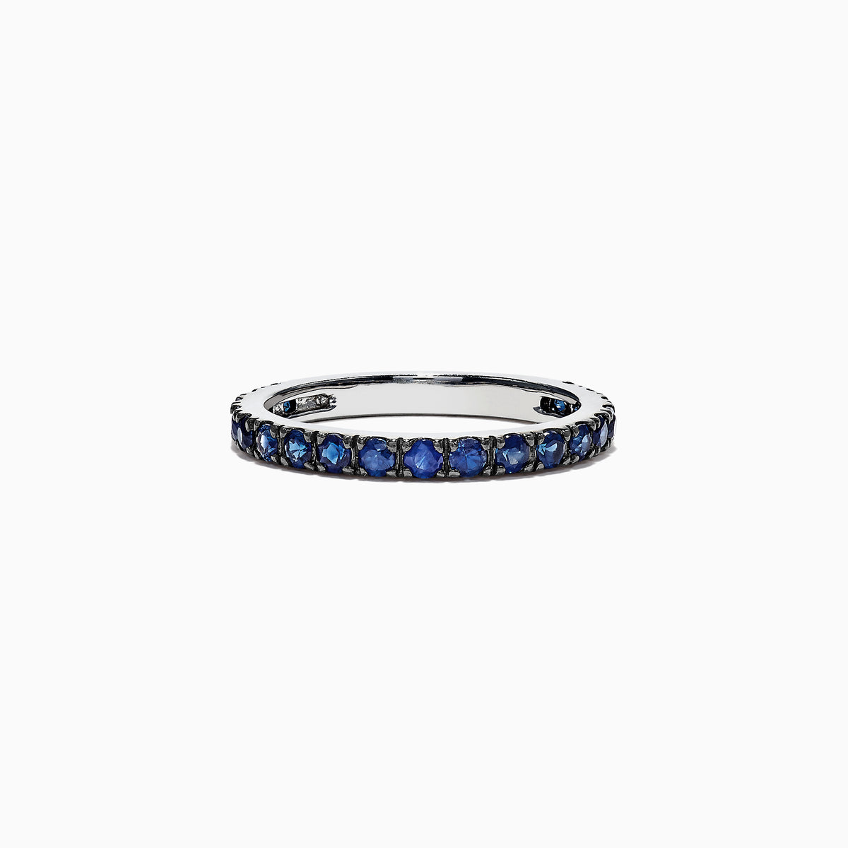 The Royale Bleu 14K White Gold Blue Sapphire Band Ring, 0.99 TCW, features a row of small round blue sapphires set all around a white gold band and is displayed on a plain white background.