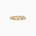 The 14K Yellow Gold Yellow and White Sapphire Band Ring, 0.94 TCW, features alternating round sapphires set in a single row along the band and is displayed against a plain white background.