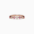 The 14K Rose Gold Pink Sapphire and Diamond Band Ring, 0.27 TCW, showcases alternating pink sapphires and diamonds in a repeating diamond-shaped pattern around the band.