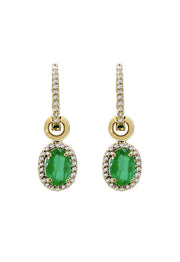 Brasilica 14K Yellow Gold Emerald and Diamond Earrings, 1.78 TCW, feature oval green emeralds with diamond halos. Pavé-set accents decorate the hooks, and a circular gold detail above each gem adds a touch of elegance.