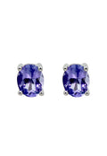 A pair of 14K white gold oval tanzanite stud earrings, 0.65 TCW, shown on a white background.