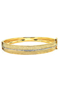 The DOro 14K Yellow Textured Gold Diamond Bangle features a central row of sparkling diamonds totaling 0.56 carats set in a textured yellow gold design.