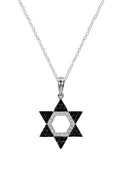 A striking Effy Novelty 14K gold Star of David pendant features 0.29 TCW black and white diamonds set in a hexagonal open design.
